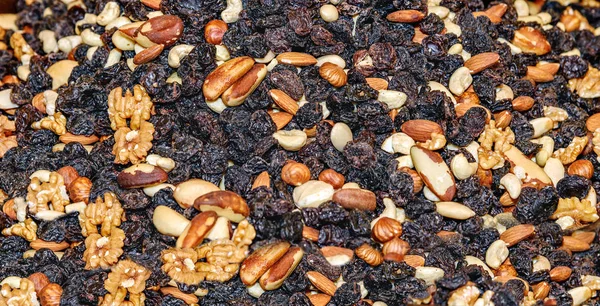 Mixture of nuts with raisins. Brazilian, walnut, cashew, hazelnut, almonds. Food for students