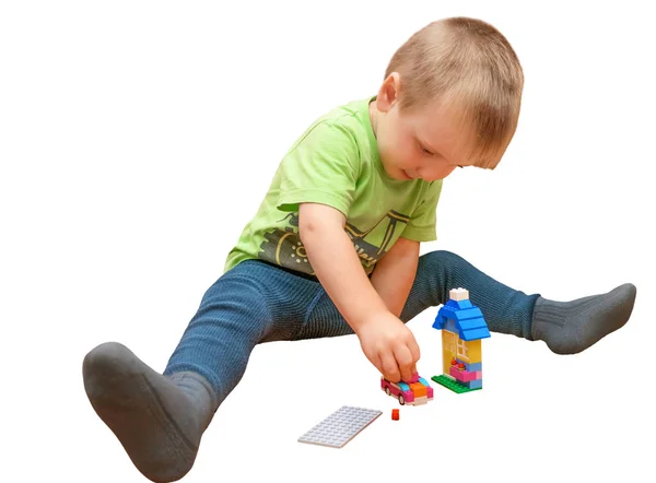 Little boy plays with colored cubes. Isolated — Stockfoto