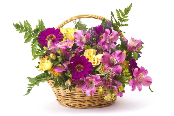 Colorful flowers in a basket — Stock Photo, Image