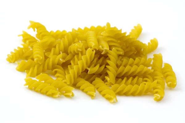 Raw pasta, fusilli on white background — Stock Photo, Image