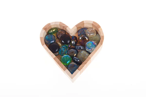 Wooden casket in the form of heart with colored stones — Stock Photo, Image
