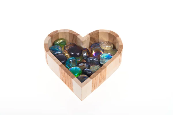 Wooden casket in the form of heart with colored stones — Stock Photo, Image