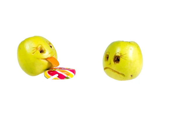 Happy and sad emoticons apple licking a lollipop. Feelings, atti — Stock Photo, Image