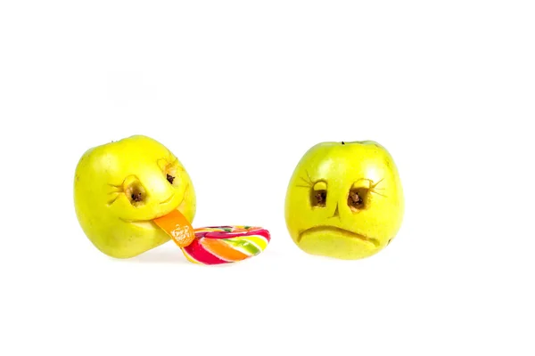 Happy and sad emoticons apple licking a lollipop. Feelings, attitudes and emotions.