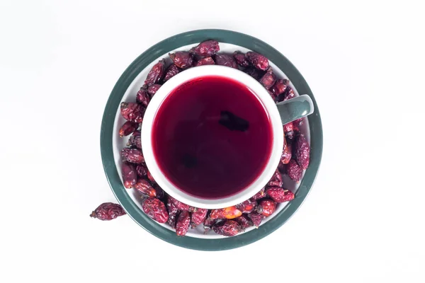 Una taza de té caliente de rosa mosqueta vitamina caliente invierno y curar los resfriados . — Foto de Stock