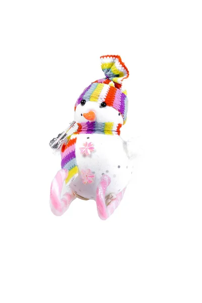 Toy snowman on skis from a pink candy striped on a white backgro — Stock Photo, Image