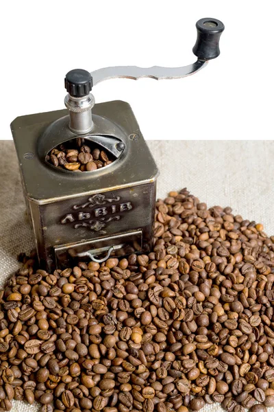 Still life with coffee beans and old coffee mill on the wooden background — Stock Photo, Image