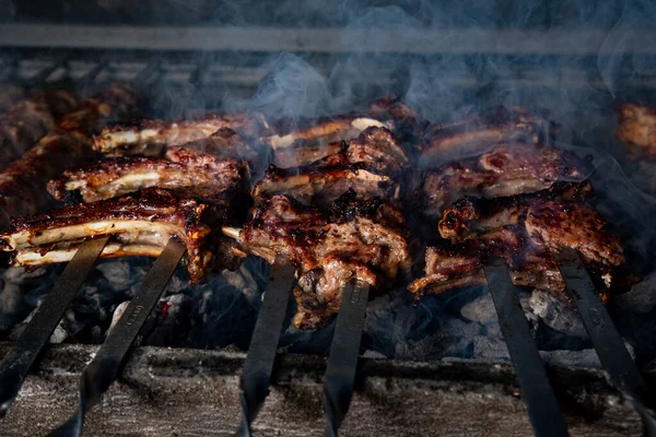 beef kababs on the grill closeup in smoke