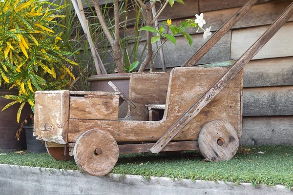 Car made of wood,childhood toy car Drive. funny old stone age ca — Stock Photo, Image