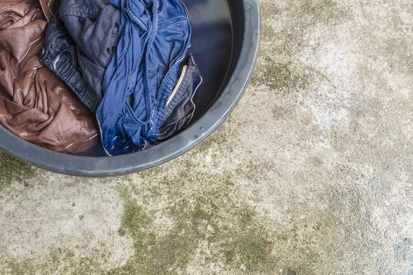 Close up Soak dirty clothes in the basin black for cleanse