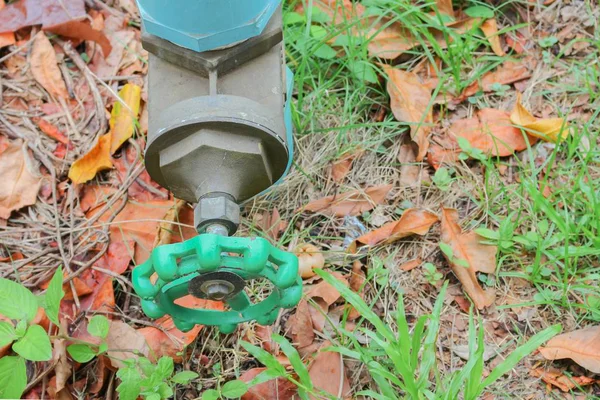 Water valve Plumbing Steel on grass. Top view industrial tap wat — Stock Photo, Image