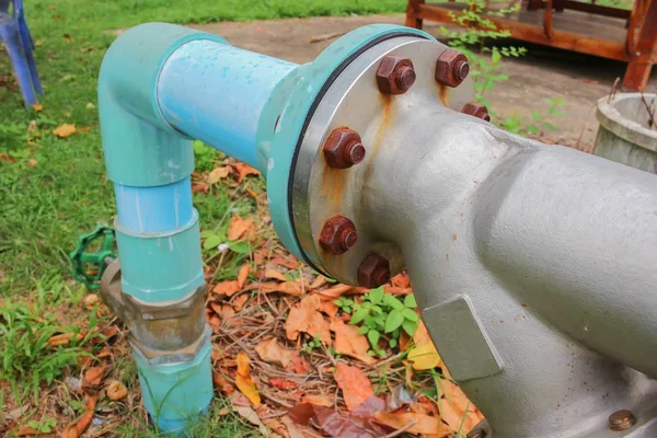 Water valve Plumbing Steel on grass. industrial tap water pipe a — Stock Photo, Image