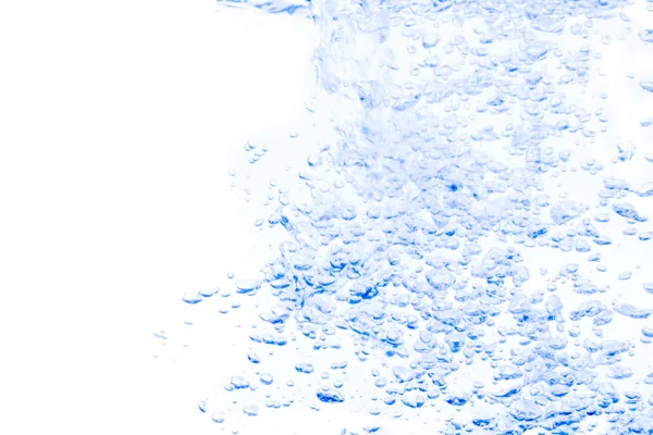 Water splash with bubbles of air, on the Blue background. — Stock Photo, Image