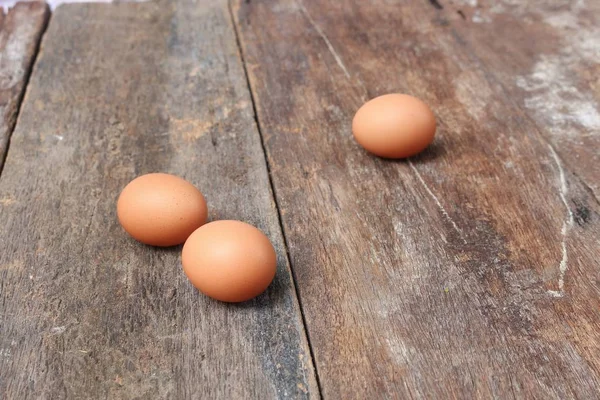 egg select focus with shallow depth of field on wood background