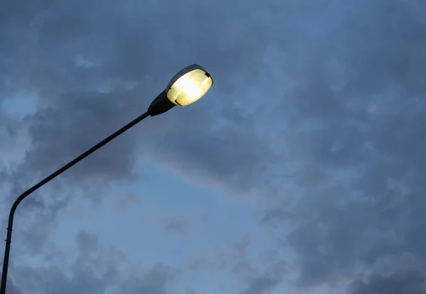 Lantern on a pole evening sky background — Stock Photo, Image