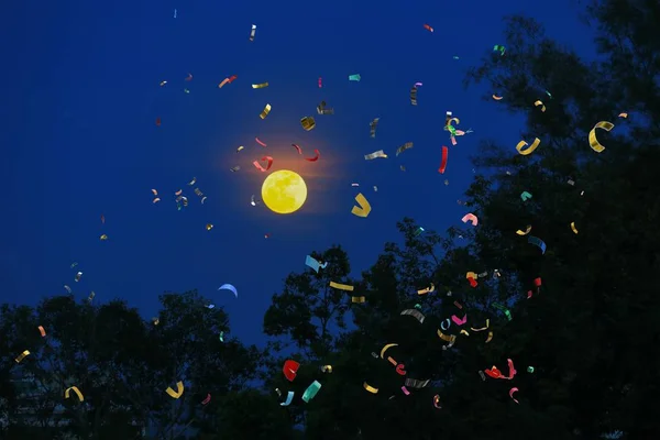 Ribbon motion multicolored in day Christmas and New Year on Sky — Stock Photo, Image