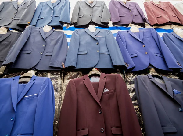 Men\'s suits in a shop market outlet