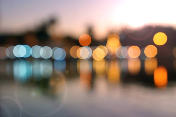 Abstract multicolor blurred bokeh light with water reflection an — Stock Photo, Image