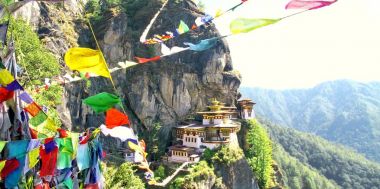Taktshang Goemba or Tiger's nest monastery with colorful Tibetan clipart