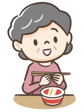 Yaşlı bir kadın ramen yiyor.