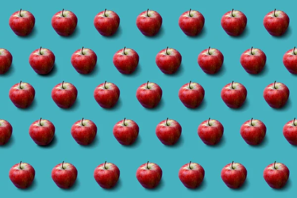 Apples pattern on blue background. Fresh. Nature.