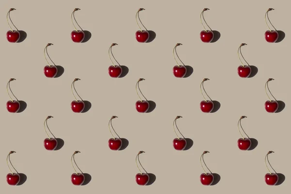 Yumuşak kahverengi arka planda izole edilmiş kiraz deseni. Taze. Doğa.