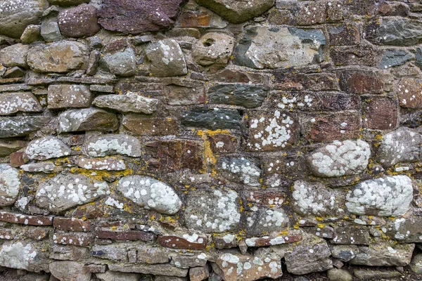 Eine Alte Und Verwitterte Steinmauer — Stockfoto