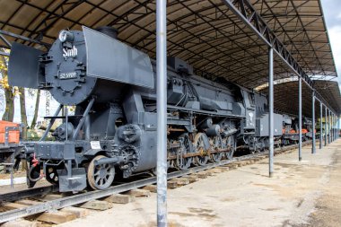 Old german steam locomotive, built in 1940, in a museum. clipart