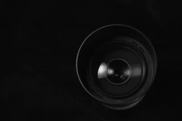 Telephoto lens aperture close up concept. Dark silhouete photo.