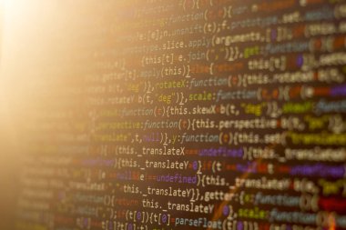 Minificated web geliştirme javascript koduna yakın çekim günbatımı ışınları