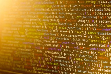 Minificated web geliştirme javascript koduna yakın çekim günbatımı ışınları