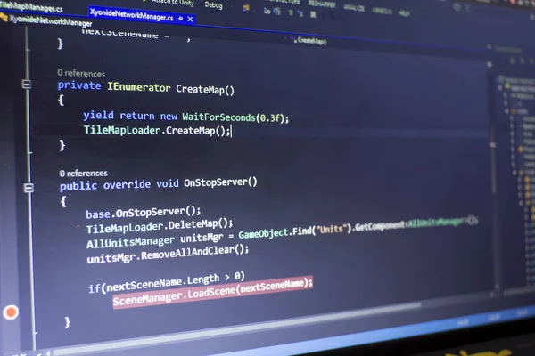 Software development C-Sharp (C#, .NET) code. Abstract information technology modern background. Developing network multiplayer game in IDE. Lines of high-level API code. Screen of game developer.