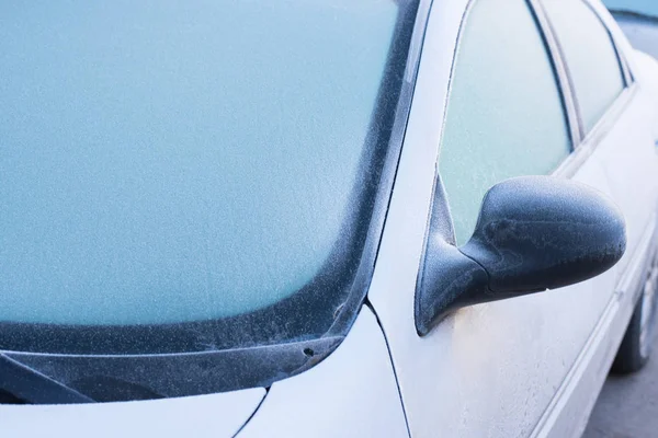 Frozen windshield wiper on car. Frozen windshield.   car windshield in winter. Frozen front window of a car. Frozen car windshield in winter.  Front Glass. Cold winter.