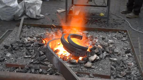Blacksmith fire with hot metal — Stock Video