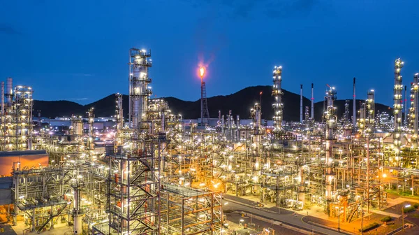 Aerial view petrochemical plant and oil refinery plant background at night,  Petrochemical oil refinery factory plant at night.