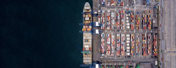 Container ship loading and unloading in deep sea port, Aerial view of business logistic import and export freight transportation by container ship in open sea, Container loading Cargo freight ship.