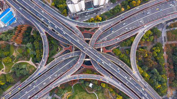 Aerial view Shanghai spectacular elevated highway and convergence of roads, bridges, junction and interchange overpass, viaducts in Shanghai, transportation and infrastructure development in urban China.