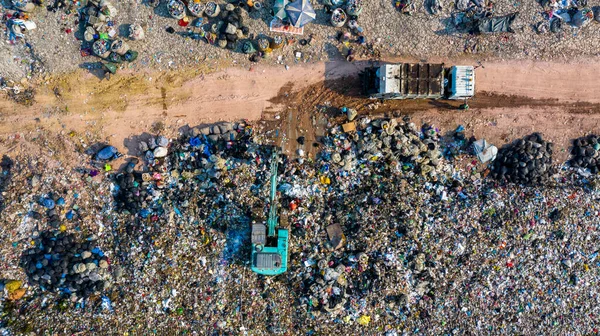 Garbage pile in trash dump or landfill, Aerial view garbage trucks unload garbage to a landfill, global warming, Ecosystem and healthy environment concepts and background.