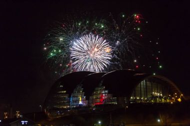 Fireworks at Newcastle Quayside over Sage Gateshead concert hall clipart
