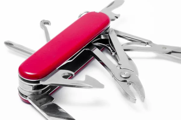 Faca vermelha multi-ferramenta, isolado no fundo branco — Fotografia de Stock