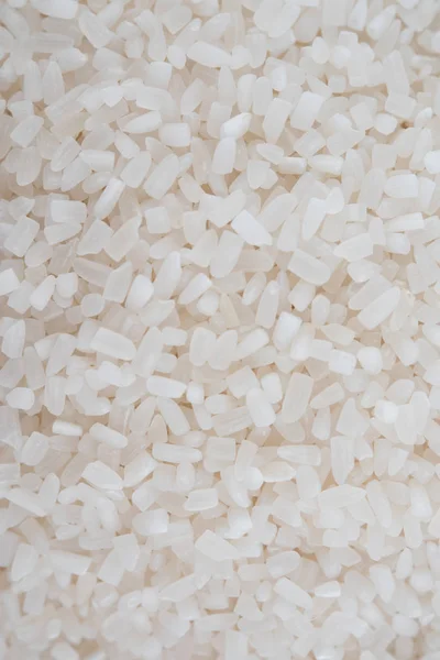 Arroz branco, grão de arroz longo natural para fundo e textura sobre fundo branco — Fotografia de Stock