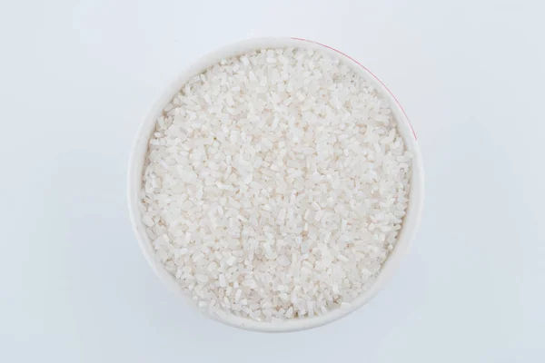 Arroz branco, grão de arroz longo natural para fundo e textura sobre fundo branco — Fotografia de Stock