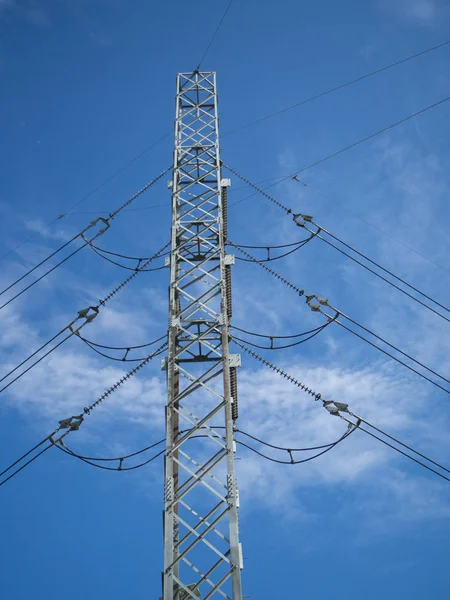 A high voltage power pylons against blue sky — Stock Photo, Image