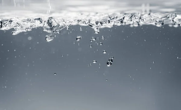 Bellen van water, een afbeelding van een mooi water belletjes achtergrond — Stockfoto
