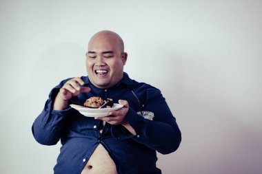 fat man eating, portrait of overweight person feels hungry and e clipart