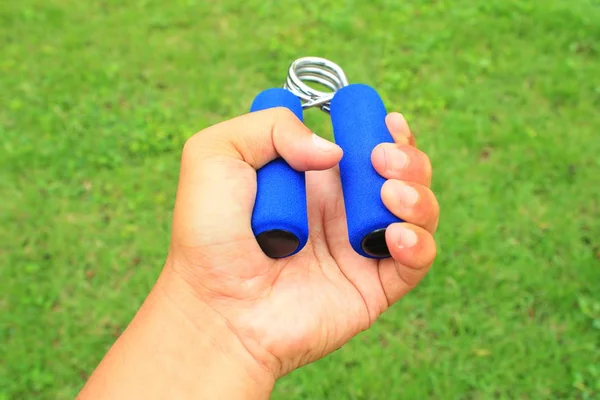 hand grip strengthener on the left hand for physiotherapy