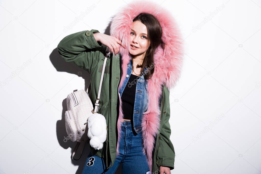 girl in parka coat with pink fur