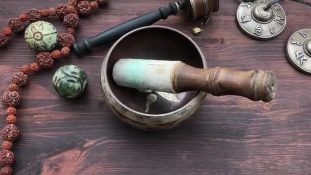 Tibetan Singing Bowl and religious articles — Stock Video