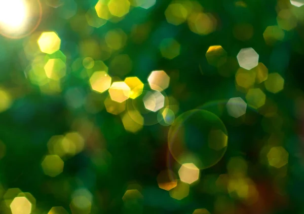 Green background with yellow bokeh, blurred background — Stock Photo, Image