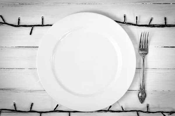 White empty plate with a fork — Stock Photo, Image